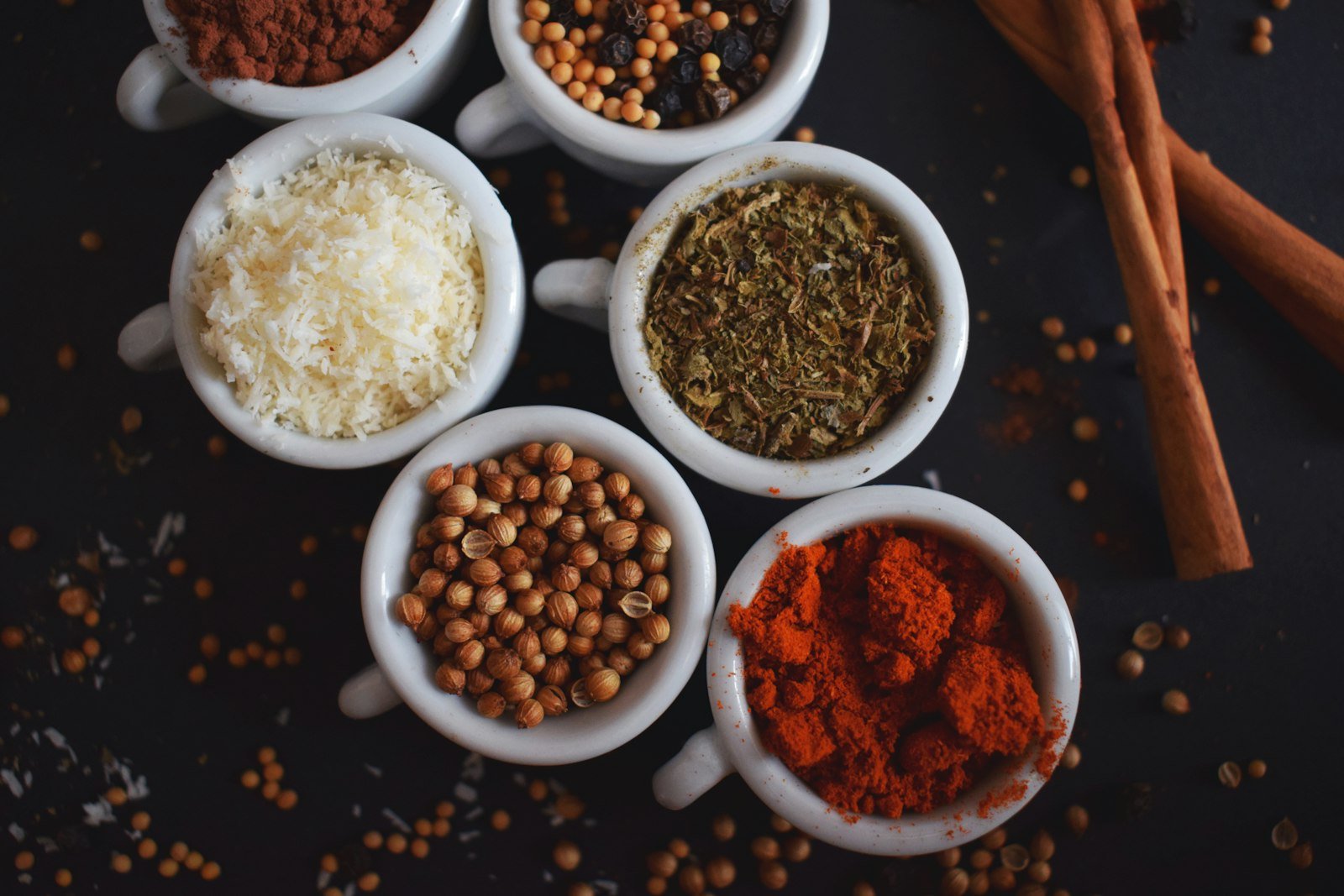 Bowls of organic spices, seeds and grains